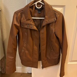 Beautiful leather jacket in new condition size is XS but it could fit small size